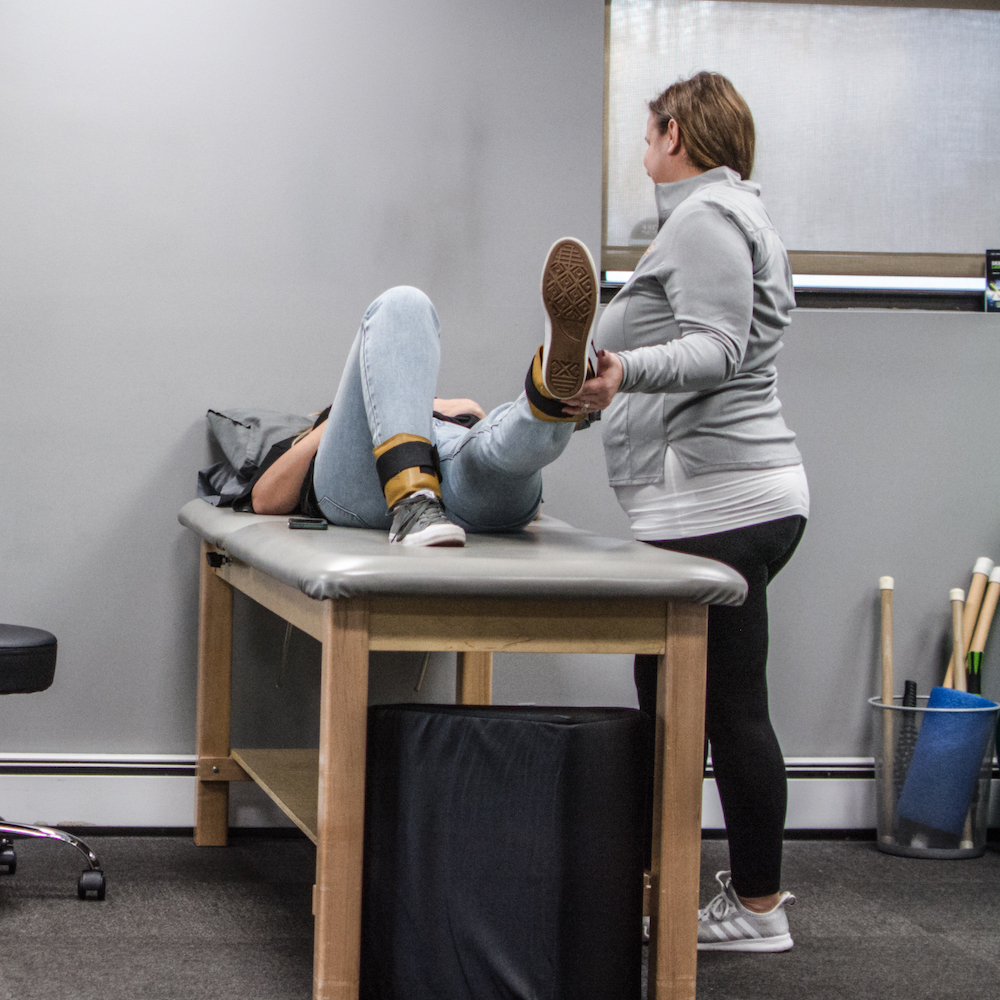 patient working with physical therapist in Yonkers on leg strength
